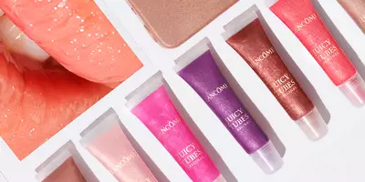 Brillo labial Juicy Tubes en tonos morado, rosa, marrón, nude y fucsia.